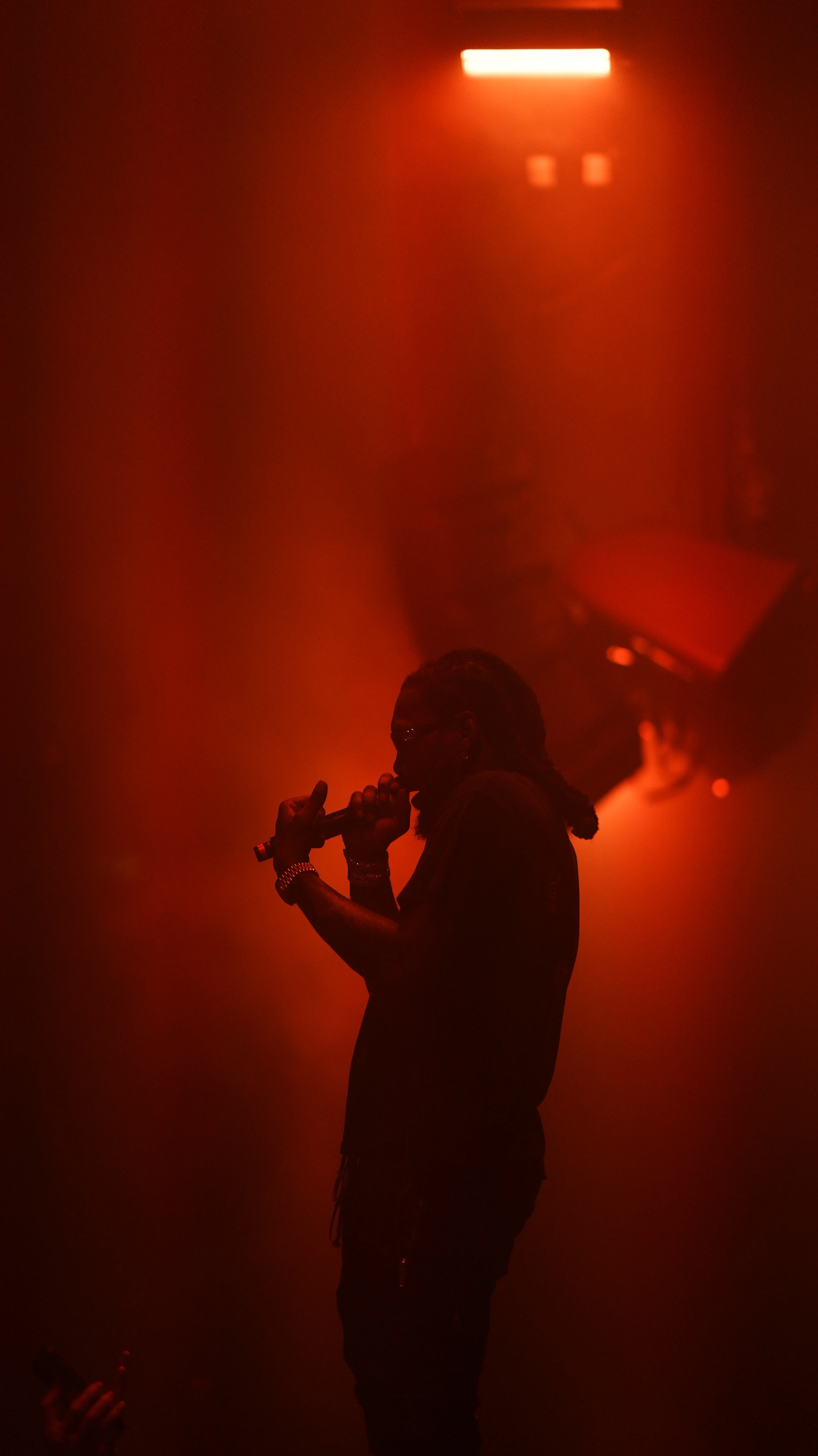 Offset silhouetted in red stage light at Klein Phönix